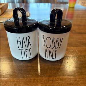 Rae Dunn hair ties and bobby pins canister.